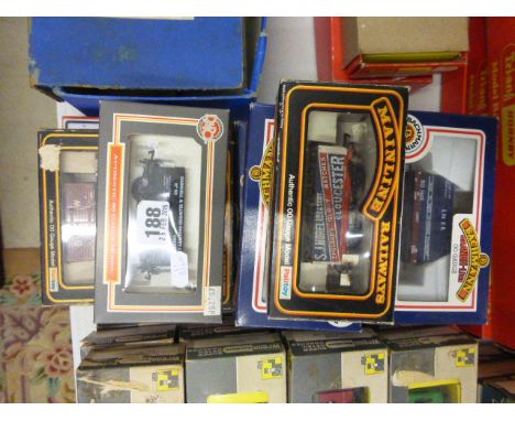 12 Boxed OO gauge wagons including Bachmann x 5 (33-951, 33-952, 33-976 x 2 &amp; 33-975), Mainline x 4 (37179, 37-167 x 2 an