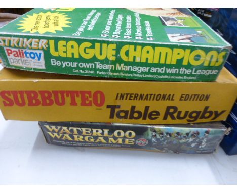 Three vintage boxed games including Parker Striker, Subbuteo Rugby and Airfix Waterloo War Game