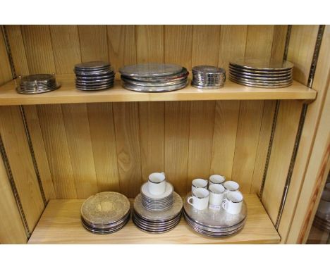 A collection of chased silver plated underplates &amp; coasters, various together with a selection of porcelain demitasse cup