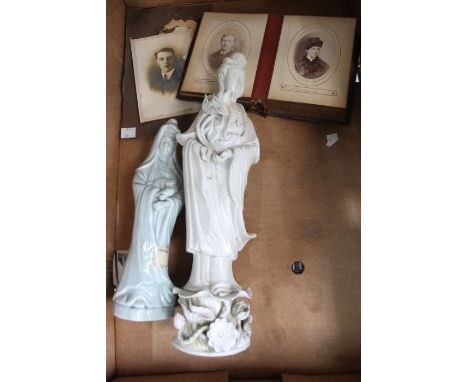 Two Chinese figures both bearing Sotherby's labels, together with vintage photographs