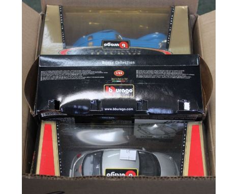 A box of Burago model cars, mostly boxed