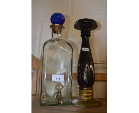 Glass water syphon and a candlestick