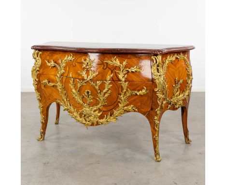 Pierre Roussel (1723-1782) A two-drawer commode, mounted with ormolu bronze and finished with a red marble top.The commode is