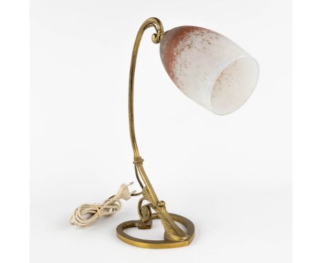 A bronze table lamp with a Pâte-De-Verre lampshade, signed Lorrain.&nbsp;(L:14 x W:28 x H:36 cm)