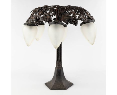 A table lamp with opaline lampshades, art deco style. Wrought iron and glass.&nbsp;The second half of the 20th century.&nbsp;
