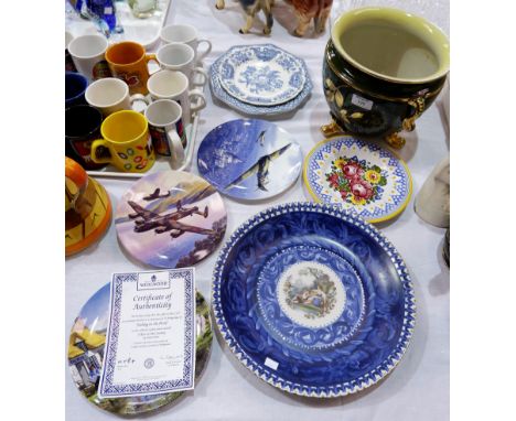 A continental painted wall plaque; 2 collectors plates with WWII planes; blue and white collectors plates; a green and gilt p