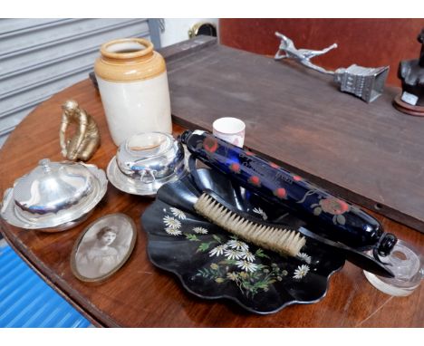 A vintage blue glass rolling pin and a selection of decorative items