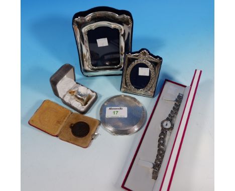 A marcasite dress watch; 2 silver photo frames; an engine turned silver compact, Birmingham 1940; a silver christening thimbl