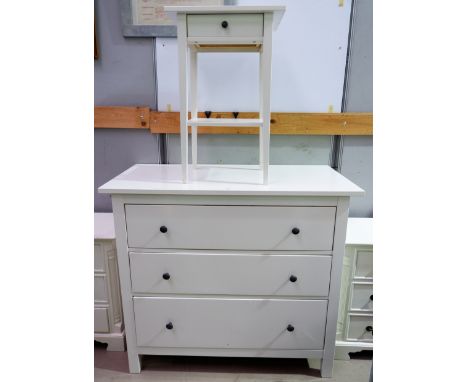 A modern white 3 drawer chest; a shelf/bedside table unit