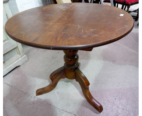 A Victorian pine occasional table with circular tilt top; a brass occasional table on folding base; an Art Deco oak firescree