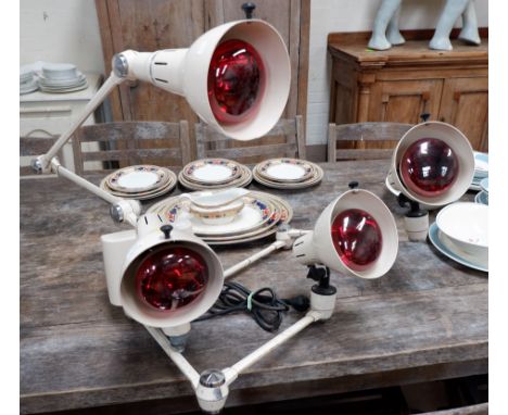 A 1950's Infra health/heat lamp, wall mounted with 4 adjustable lights (sold as a collector's item only)