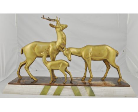 Art Deco group of three Deer, After R. Rochard, lacquered patination, set on a alabaster and hard stone plinth, width 67cms.