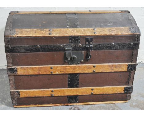 19th Century domed travelling trunk, with strapping and a bamboo and cane crib, (2).