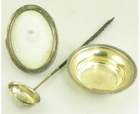 A GEORGE V SILVER DISH WITH APPLIED RIM, BIRMINGHAM 1930, A SILVER OVAL PHOTOGRAPH FRAME AND A PUNCH LADLE WITH TWISTED BALEE