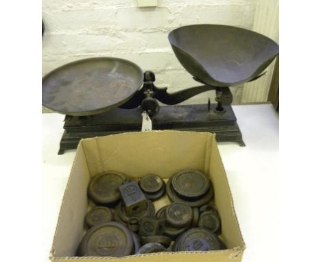 A SET OF CAST IRON GROCER'S SCALES AND A QUANTITY OF IRON WEIGHTS, EARLY 20TH C