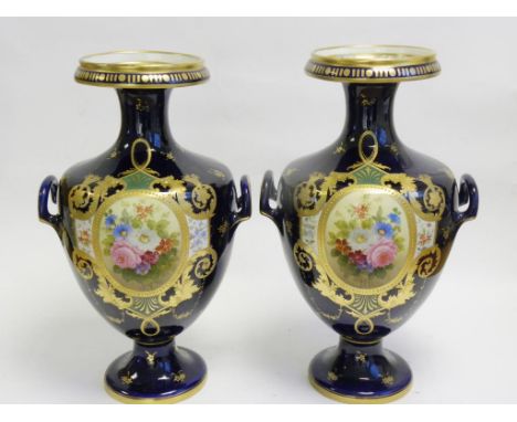 A PAIR OF ERNST WHALISS COBALT GROUND VASES RICHLY DECORATED IN ROYAL CROWN DERBY STYLE WITH PAINTED OVAL PANELS OF FLOWERS I