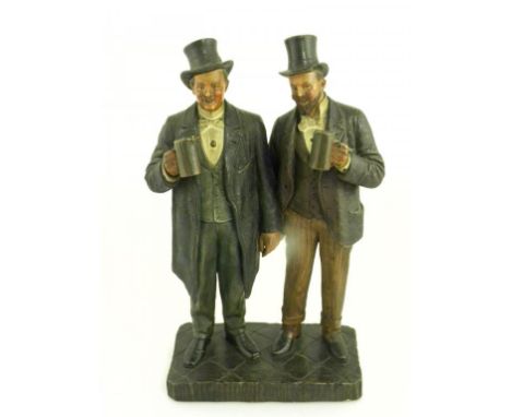 A CONTINENTAL COLD PAINTED TERRACOTTA GROUP IN THE MANNER OF GOLDSCHEIDER OF TWO SMILING MEN HOLDING A MUG OF ALE, IMPRESSED 