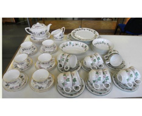 A ROYAL DOULTON BONE CHINA TIVERTON PATTERN DINNER SERVICE AND A ROYAL WORCESTER JUNE GARLAND PATTERN TEA SERVICE