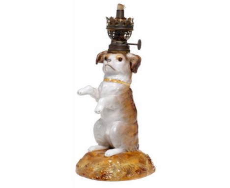 A SITZENDORF PORCELAIN BEGGING DOG OIL LAMP with brass burner, impressed 100, blue lines mark, with original glass eyes, burn