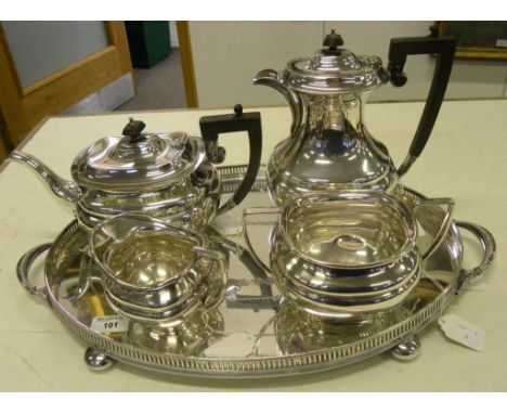 AN EPNS FOUR PIECE TEA SERVICE AND AN OVAL GALLERY TRAY