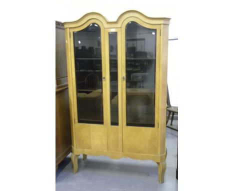 A LIGHT WOOD DOUBLE DOME CHINA CABINET