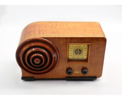 Emerson 'Bullseye' radio with birds eye maple case and mahogany circular louvered speaker and square dial, 1943. Case size ap