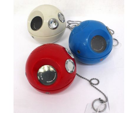 Three novelty National Panasonic R-70 Panapet radios of ball shape with metal chains, one in red, one blue, other white. (3) 