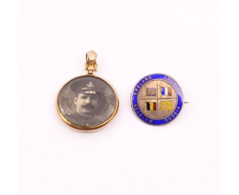 A scarce yellow metal mounted circular 1914 Birmingham Battalion pendant, with enamel decoration to the front side, and the r