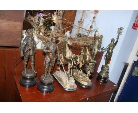 Two pairs of spelter figures and a pair of Marley horses