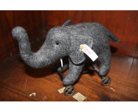 A Steiff elephant on wheels