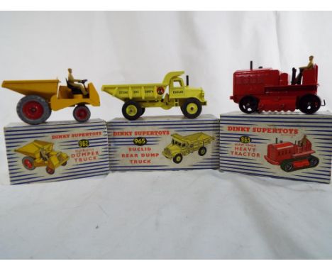Dinky Supertoys - a Euclid Rear Dump Truck model 965, deep canary yellow, excellent, a Dumper Truck model 962, excellent and 