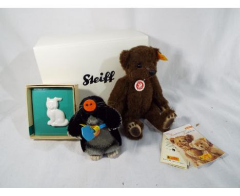 A Friends for Life jointed bear by Steiff, alpaca brown, boxed, a 1960's Steiff mole and a porcelain Steiff Boutique porcelai