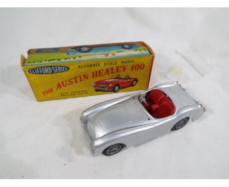 Clifford Series (Hong Kong) - an Austin Healey 100, silver coloured plastic Sports Car, with red interior, (windscreen includ