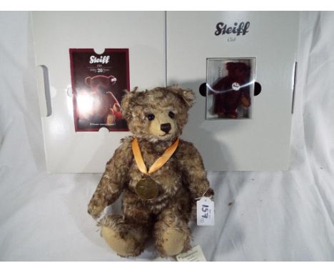 A Danbury Mint by Steiff 2009 jointed teddy bear with growler with commemorative medal and a boxed miniature burgandy Steiff 