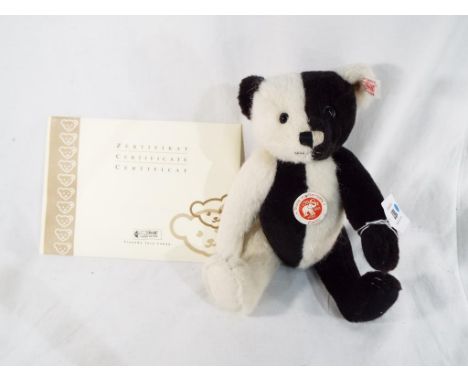 A limited edition Steiff Pierrot black and white jointed Bear, 26 cm (h) with certificate of authenticity