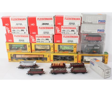 A collection of 17 boxed Fleischmann HO gauge goods wagons and vans - 1960s-1990s, European outline, comprising A1211 / 1214 