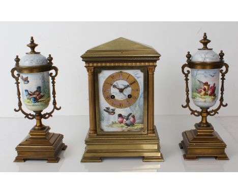 A French Japy Freres gilt brass and porcelain three-piece ornithological subject clock garniture - early 20th century, the ar