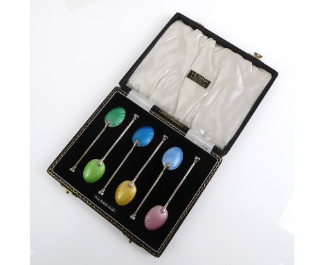 A cased set of six Elizabeth II silver and enamel coffee spoons - Henry Clifford Davis, Birm. 1957, the bowls with polychrome