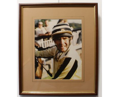 Davy Jones of The Monkees - a framed colour photograph of Jones in his jockey's silks, 34.5 x 26.8cm., the reverse of the fra
