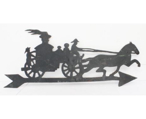 An antique wrought iron weather pierced vane modelled as a horse and carriage with various figures, probably late 19th/early 