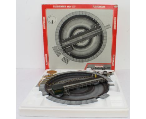 A boxed Fleischmann HO Gauge 6052 Electric Turntable Set - with controller and a selection of entry/exit tracks (E, box G, so