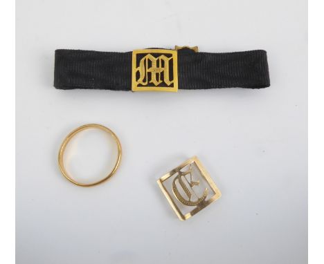 An antique 22ct gold wedding band - marked '22CT', size M&frac12;, 2.75g; together with a Victorian black silk mourning brace