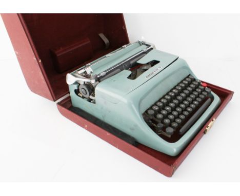 A retro 1950s Olivetti Studio 44 typewriter - in the original red faux-leather case.