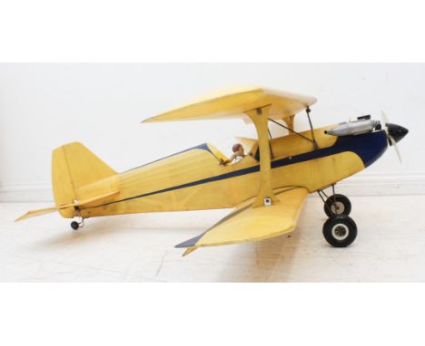 A large radio controlled model aeroplane - the biplane fitted with a Blue Bird NS glow plug model aero engine (length 118 cm.