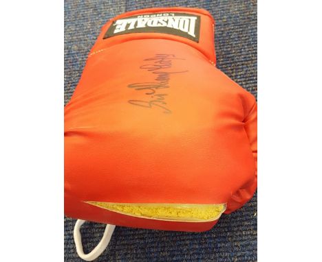 Henry Cooper signed boxing glove. Superb red Lonsdale boxing glove autographed clearly by the late Sir Henry Cooper. Symbolic