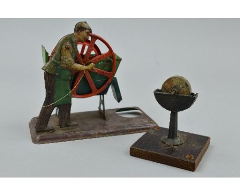 A BING STEAM WHEEL DREDGE WITH OPERATOR, jointed lithographed tinplate figure operating red wheel (missing one bucket) in a g