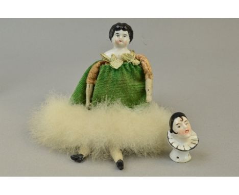 A CERAMIC HEAD DOLL, unmarked ceramic head and shoulders, cloth body with cloth and ceramic arms and legs, some minor wear, s