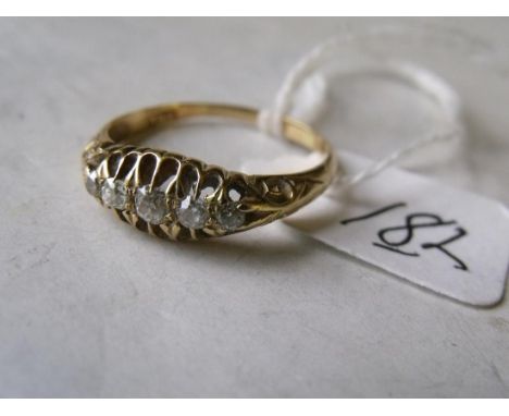 Five stone diamond ring in carved 18ct gold mount approx size 'R'       