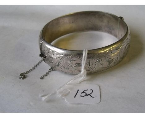 A silver hinged engraved bangle 25g     