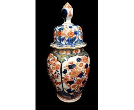 A Japanese Arita porcelain imari jar and cover, probably Edo period, baluster form beneath domed cover with large bud finial,